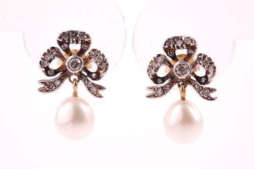 Lot 605 - A pair of diamond and pearl drop earrings, the...