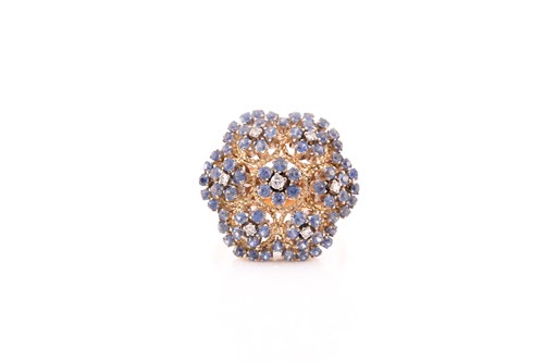 Lot 317 - A diamond and sapphire floral cluster cocktail...