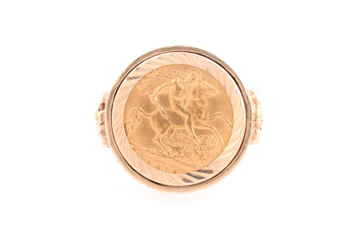 Lot 241 - A George V half sovereign ring, set in 9 ct...