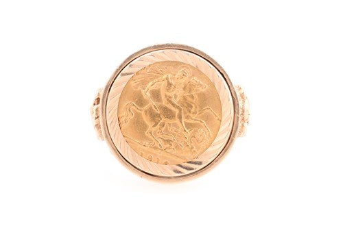 Lot 241 - A George V half sovereign ring, set in 9 ct...