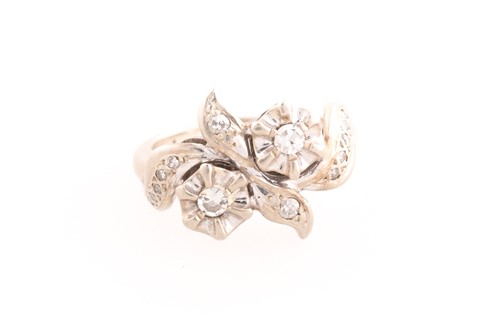Lot 346 - A 14ct white gold and diamond floral crossover...