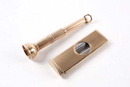 Lot 4 - A 9 ct gold cigar cutter with engine turned...