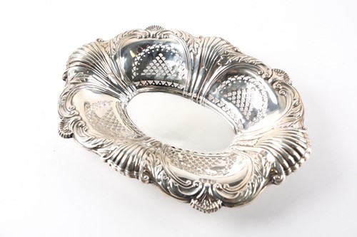 Lot 423 - A silver oval shaped bowl, embossed with...