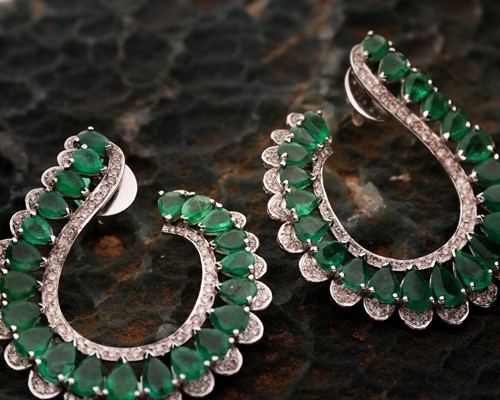 Lot 221 - A pair of diamond and emerald curved hoop...