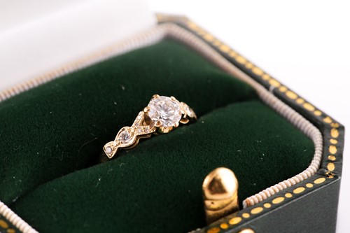 Lot 115 - An 18ct yellow gold and diamond ring, set with...