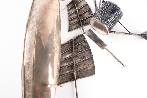 Lot 479 - A probably Hong Kong silver model of a junk....