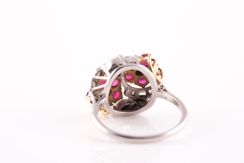 Lot 155 - A ruby and diamond floral crossover ring, set...