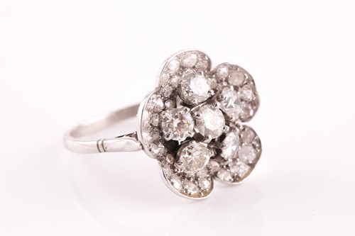 Lot 1 - A platinum and diamond floral cluster ring,...