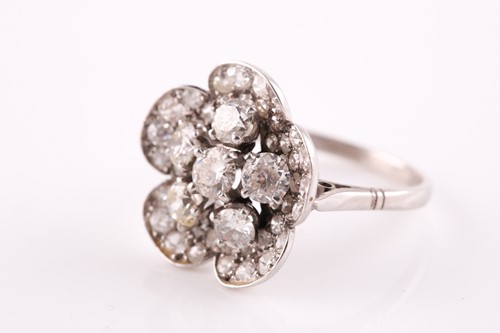 Lot 1 - A platinum and diamond floral cluster ring,...