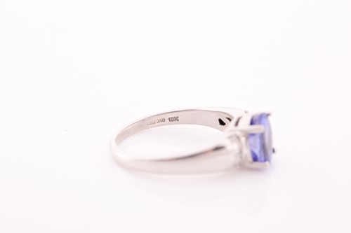 Lot 111 - An 18 ct white gold tanzinite and diamond ring,...