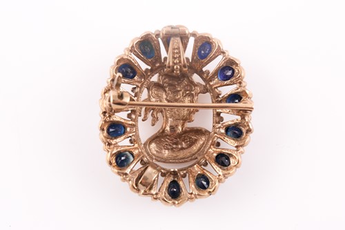 Lot 150 - A 9ct yellow gold and sapphire pendant /...