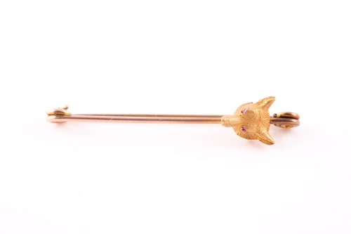 Lot 104A - A yellow metal fox head bar brooch, set with...