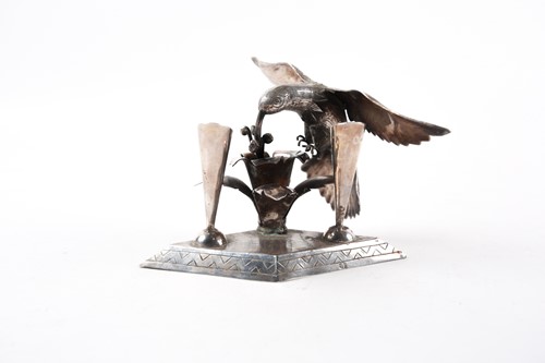 Lot 455 - A silver pen stand for two pens, modelled with...