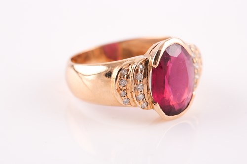Lot 124 - A ruby and diamond half hoop ring, the central...