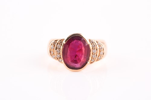 Lot 124 - A ruby and diamond half hoop ring, the central...