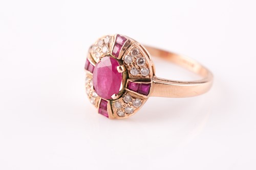 Lot 15 - A ruby and diamond cluster ring, the central...