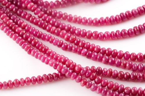 Lot 158 - An Indian ruby beaded necklace, set with nine...