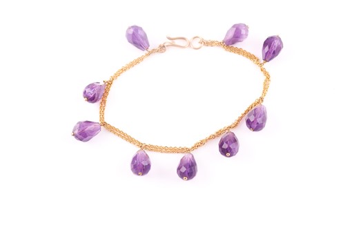 Lot 246 - A yellow metal and amethyst bracelet, the...