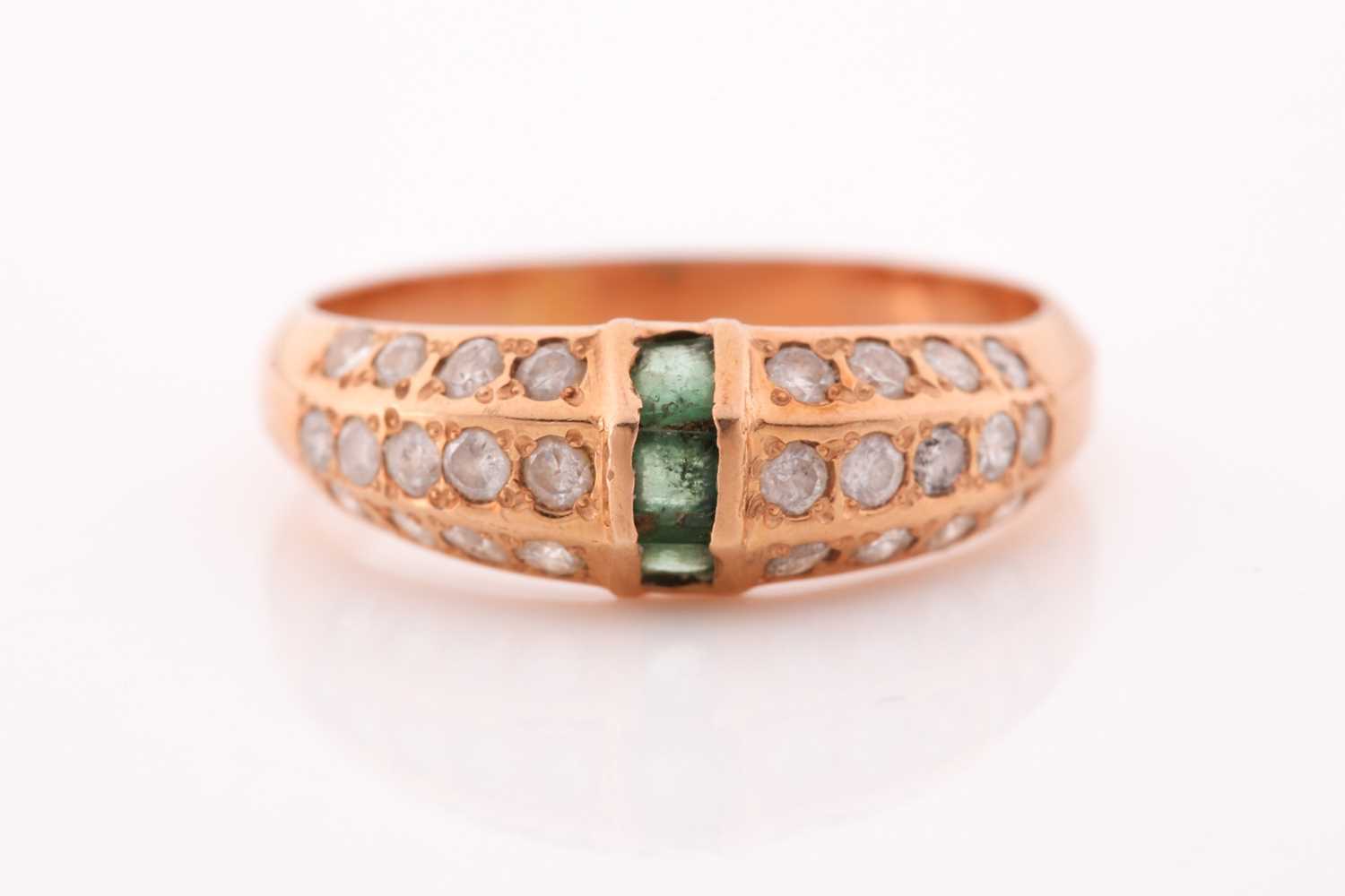 Lot 86 - A yellow metal, emerald, and moissonite ring,...