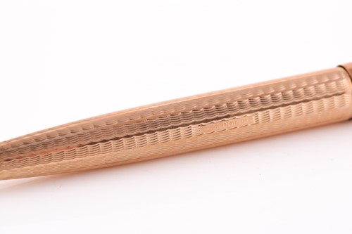 Lot 387 - A 9ct gold Parker ball point pen, with...