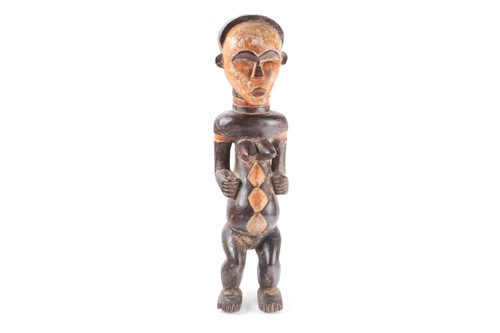 Lot 166 - A Punu standing female figure, Gabon, the face...