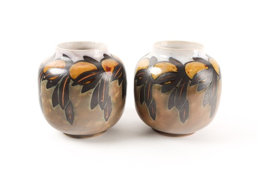 Lot 206 - A pair of Royal Doulton stoneware squat vase...