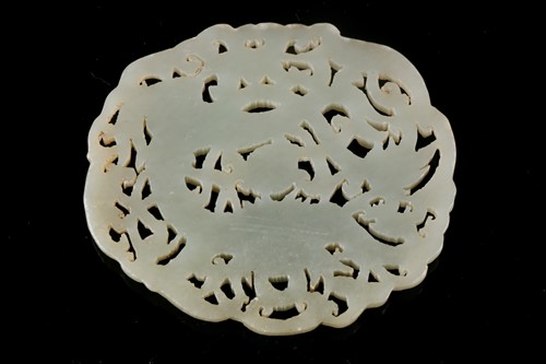 Lot 127 - A Chinese celadon jade plaque, carved with a...