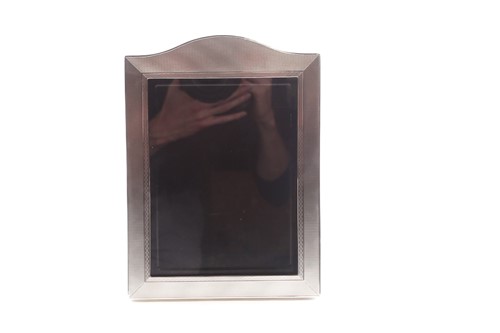 Lot 393 - An Art Deco silver photograph frame; probably...