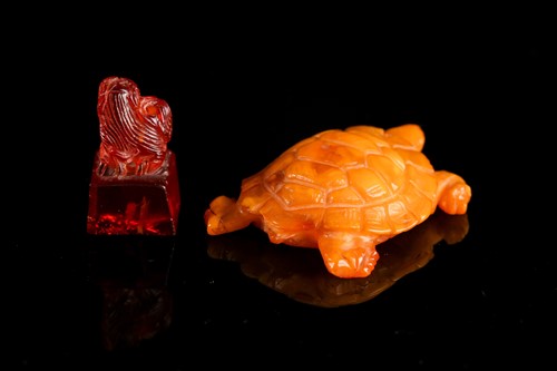 Lot 147 - A Chinese carved butterscotch / yellow amber...