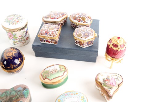 Lot 235 - Four Halcyon Days enamel pill boxes, together...