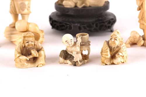 Lot 144 - A Japanese netsuke, early 20th century, carved...