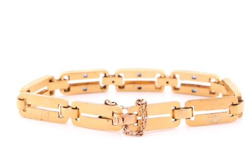 Lot 66 - A yellow metal, diamond and sapphire bracelet,...