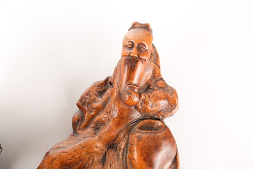 Lot 124 - A Chinese root carving of a drunken scholar,...