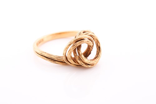 Lot 228 - An 18ct yellow gold ring, of unusual knotted...