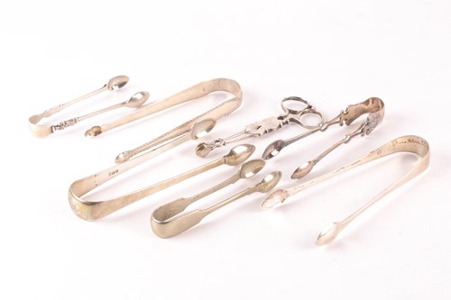 Lot 372 - A pair of George II style silver sugar tongs,...