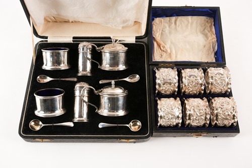Lot 454 - A set of six Victorian cased silver napkin...