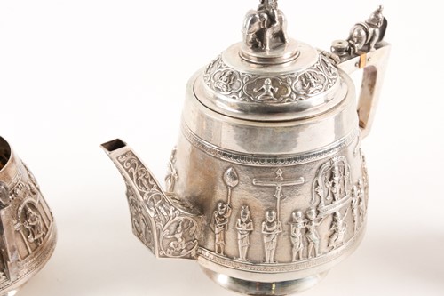 Lot 378 - An Indian white metal three-piece tea set,...