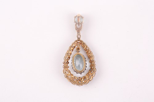 Lot 14 - A diamond and aquamarine pendant, set with a...
