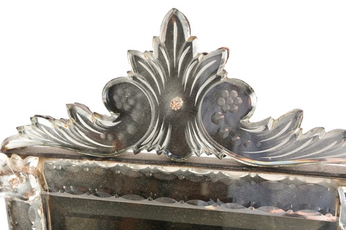 Lot 346 - A Venetian dressing table mirror, with scroll...