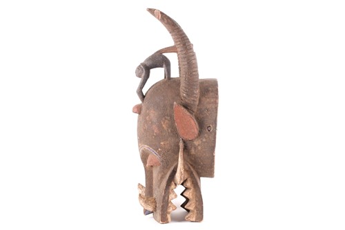 Lot 174 - A Senufo fire spitter mask, Ivory Coast, with...