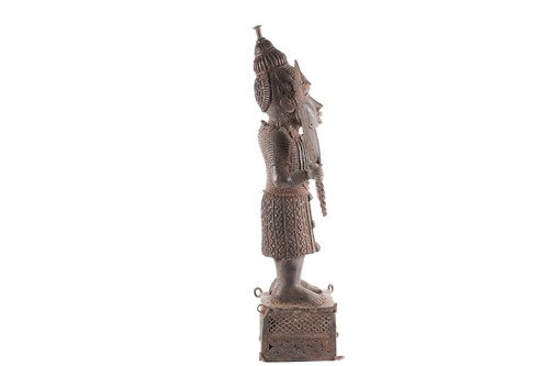 Lot 177 - A Benin bronze standing warrior figure,...