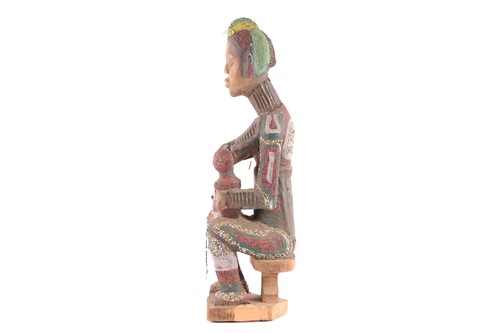 Lot 181 - An Igbo attributed beaded maternity seated...