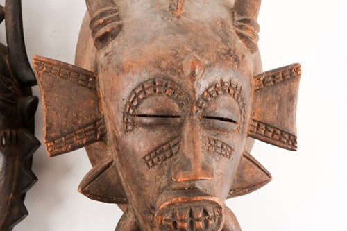Lot 186 - A Senufo Kpelie mask, Ivory Coast, with bird...