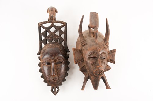 Lot 186 - A Senufo Kpelie mask, Ivory Coast, with bird...