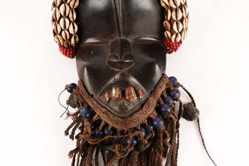 Lot 189 - A Dan mask, Liberia/Ivory Coast, a cushioned...