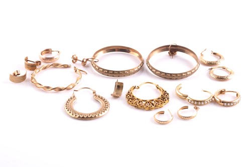 Lot 64 - A pair of 9ct yellow gold hoop earrings,...