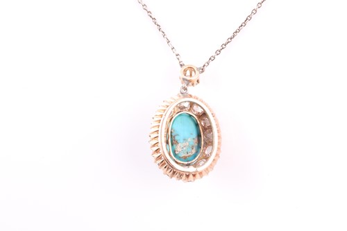 Lot 22 - A diamond and turquoise cluster pendant, set...