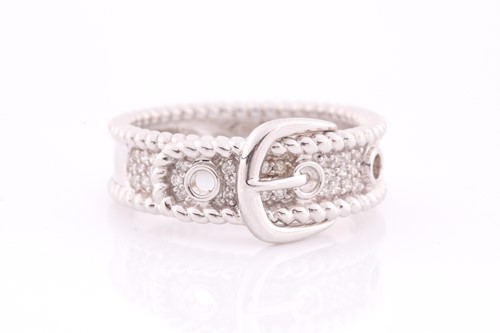 Lot 109 - An 18ct white gold and diamond buckle ring,...