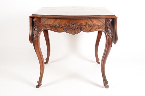 Lot 308 - A Louis XV style two flap low rosewood table...