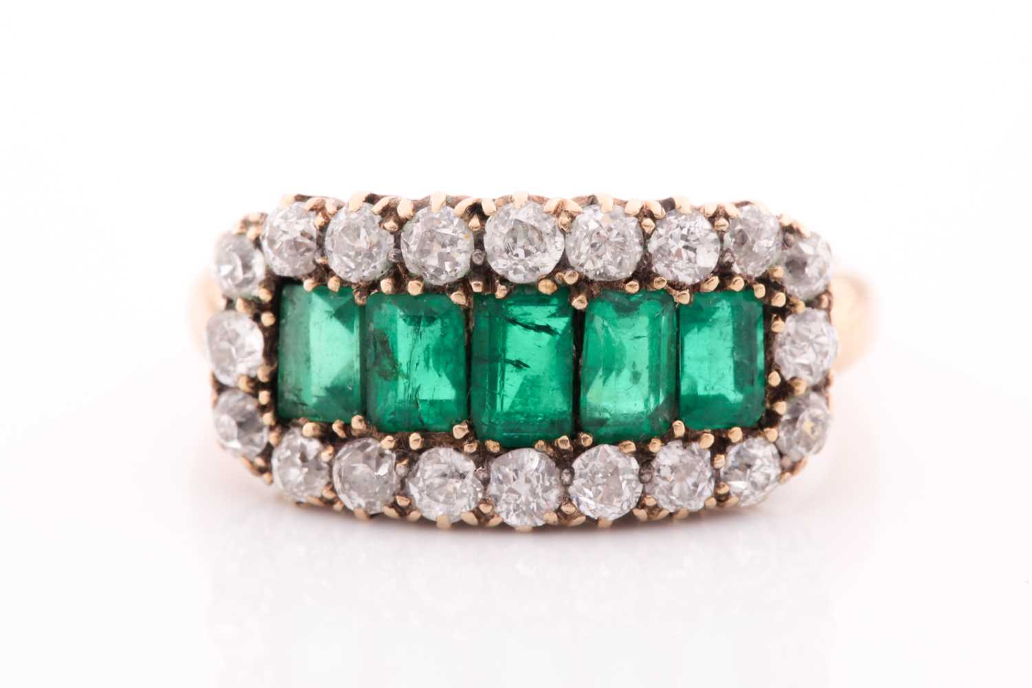 Lot 51 - An emerald and diamond three row ring, set...